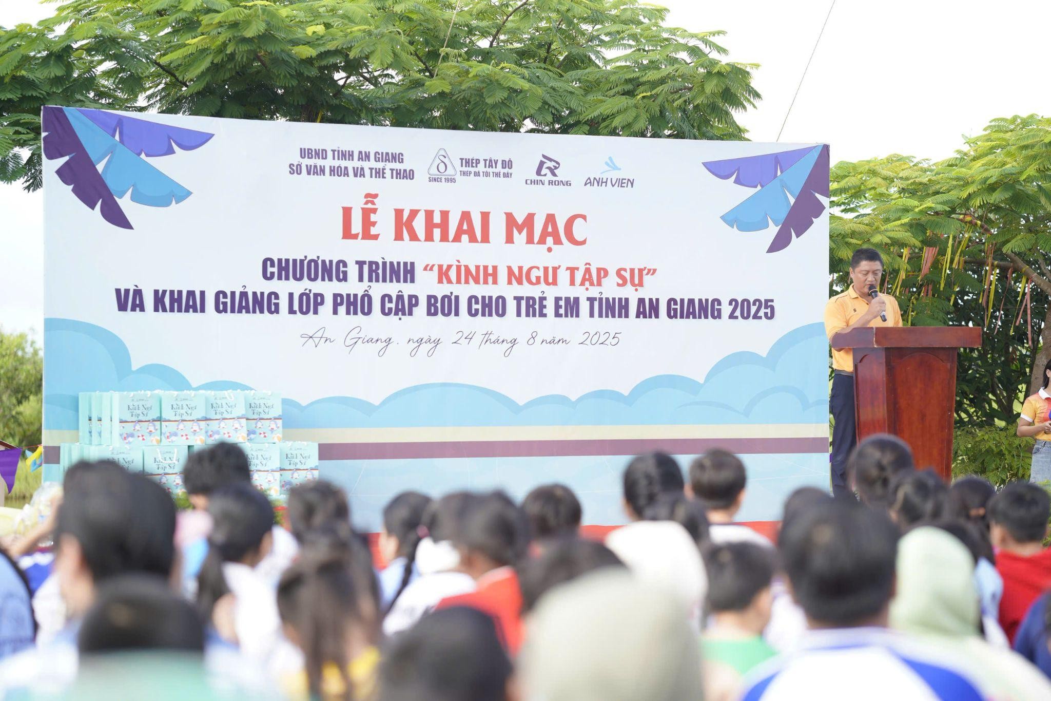 A person standing in front of a large banner

AI-generated content may be incorrect.